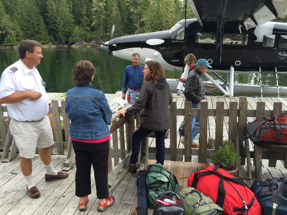 Kenmore pilot and lodge owner Hannah Bennett chat with staff and guests